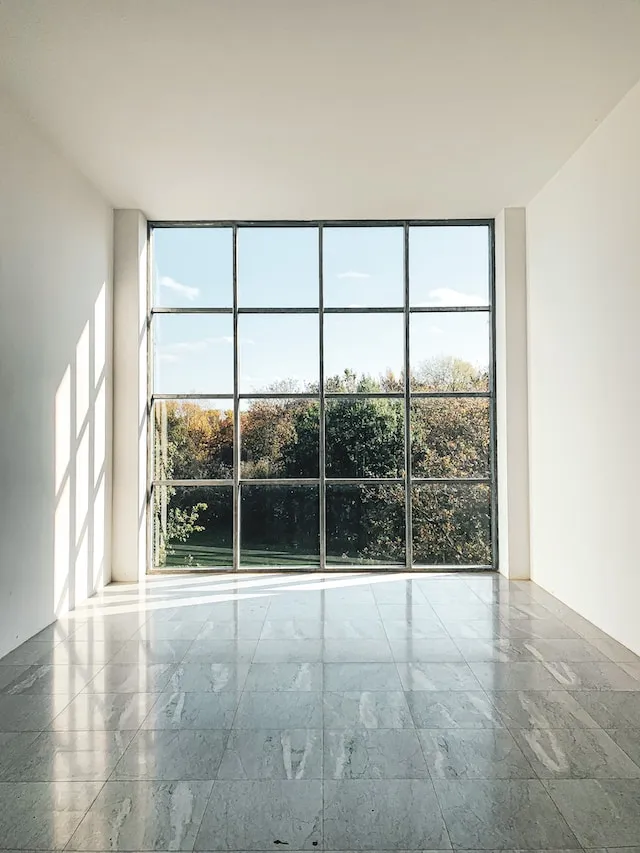 White framed glass window during daytime (Laura Cleffmann)